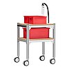 a small trolley made of aluminium profiles, with two storeys, wooden inlay shelvings, black pushbar handle made of plastics, four large, fastenable & turnable wheels, three red EURO stackable boxes and gooseneck-clip document holder with to-do list, isolated on white background