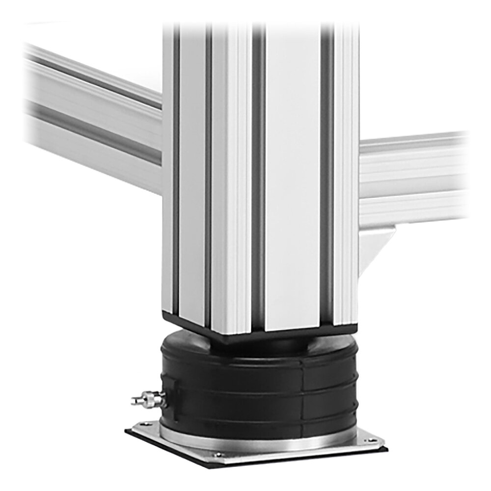 Detailaufnahme eines schwarzen Luftfeder-Elementes FLN zur Schwingungsisolierung, montiert unter ein Tischbein eines Messtisches aus Aluminiumprofil, freigestellt auf weißem Hintergrund