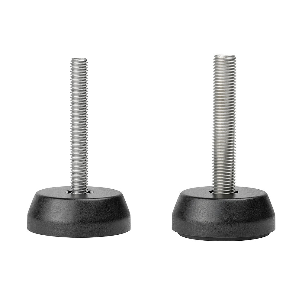 a composition of two round screw-in action levelling feet for machinery and appliances, made of black polyamide, each with a diameter of 70 mm and each with a tightly plastic-injection-moulded levelling screw in stainless steel of various lengths and strengths, in the view from askew and from above, isolated on white background