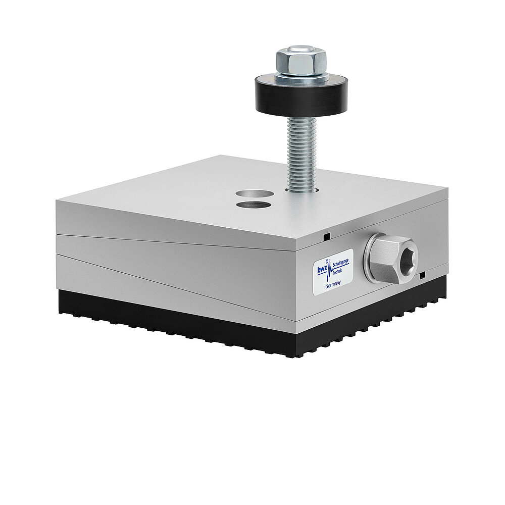 a square, height-adjustable machine mount made of precision-milled metal, adjusted in middle position, consisting of top, middle and bottom part lacquered in silver colour, with the wedge-shaped middle part featuring a protruding centered hexagonal screw for height adjustment, two holes for fastening screws in the top part, a fastening screw passing through the bottom part and sticking out on top with a screwhead isolation disc at the top screw end and a medium-thick black elastomer with structured surface for vibration isolation at the bottom, isolated on white background