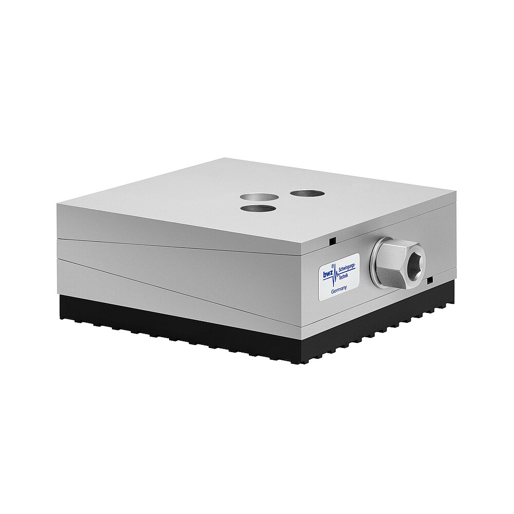 a square, height-adjustable machine mount made of precision-milled metal, adjusted in middle position, consisting of top, middle and bottom part lacquered in silver colour, with the wedge-shaped middle part featuring a protruding centered hexagonal screw for height adjustment, two holes for fastening screws in the top part and a medium-thick black elastomer with structured surface for vibration isolation at the bottom, isolated on white background