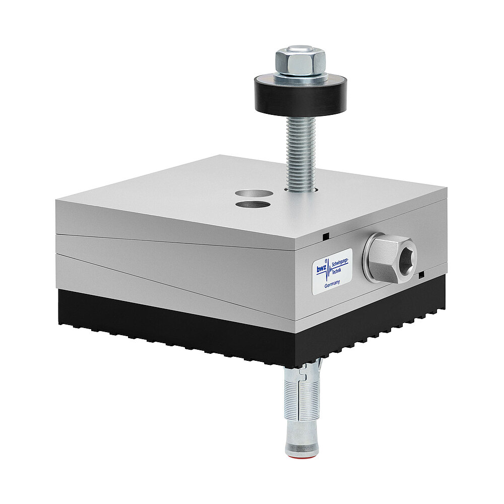 a square, height-adjustable machine mount made of precision-milled metal, adjusted in middle position, consisting of top, middle and bottom part lacquered in silver colour, with the wedge-shaped middle part featuring a protruding centered hexagonal screw for height adjustment, two holes for fastening screws in the top part, a fastening screw passing through the bottom part and sticking out on top with a screwhead isolation disc at the top screw end, a thick black elastomer with structured surface for vibration isolation at the bottom and below, a zinc-galvanized ground dovel, isolated on white background
