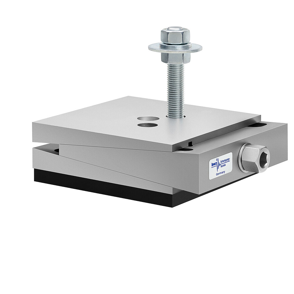 a square, height-adjustable machine mount made of precision-milled metal, adjusted in minimum height position, consisting of top, middle and bottom part lacquered in silver colour, with the wedge-shaped middle part featuring a protruding centered hexagonal screw for height adjustment, two holes for fastening screws in the top part, a fastening screw fastened in the bottom part and a medium-thick black elastomer with smooth surface for passive vibration isolation at the bottom, isolated on white background