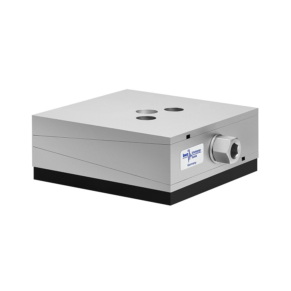 a square, height-adjustable machine mount made of precision-milled metal, adjusted in middle position, consisting of top, middle and bottom part lacquered in silver colour, with the wedge-shaped middle part featuring a protruding centered hexagonal screw for height adjustment, two holes for fastening screws in the top part and a medium-thick black elastomer with smooth surface for vibration damping at the bottom, isolated on white background