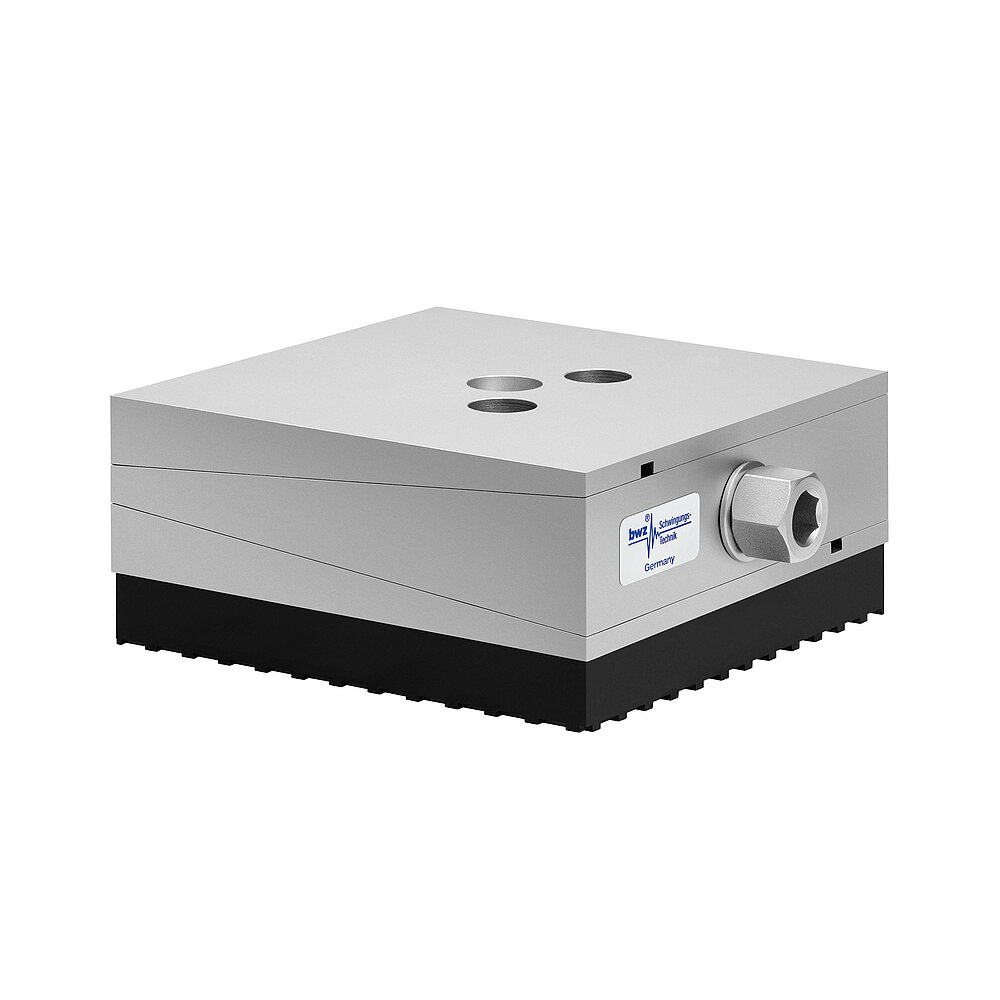 a square, height-adjustable machine mount made of precision-milled metal, adjusted in middle position, consisting of top, middle and bottom part lacquered in silver colour, with the wedge-shaped middle part featuring a protruding centered hexagonal screw for height adjustment, two holes for fastening screws in the top part and a thick black elastomer with structured surface for vibration isolation at the bottom, isolated on white background