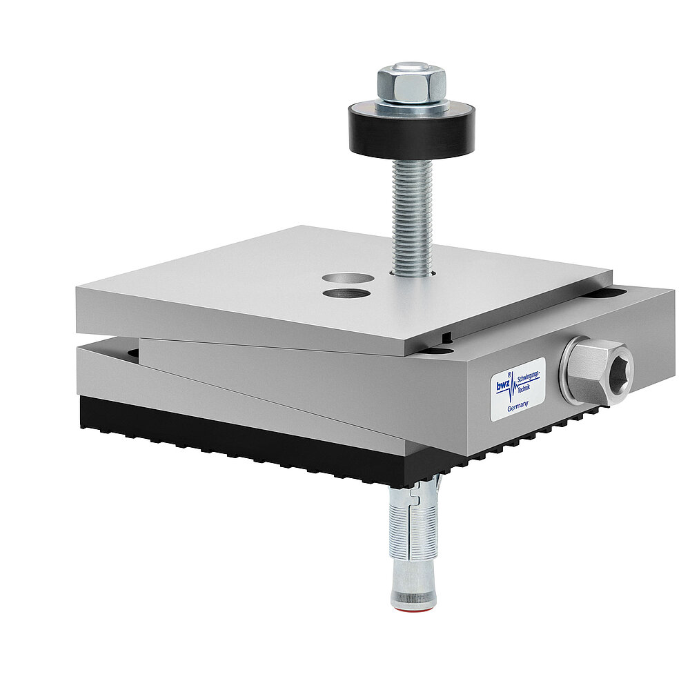 a square, height-adjustable machine mount made of precision-milled metal, adjusted in minimum height position, consisting of top, middle and bottom part lacquered in silver colour, with the wedge-shaped middle part featuring a protruding centered hexagonal screw for height adjustment, two holes for fastening screws in the top part, a fastening screw passing through the bottom part and sticking out on top with a screwhead isolation disc at the top screw end, a medium-thick black elastomer with structured surface for vibration isolation at the bottom and below, a zinc-galvanized ground dovel, isolated on white background