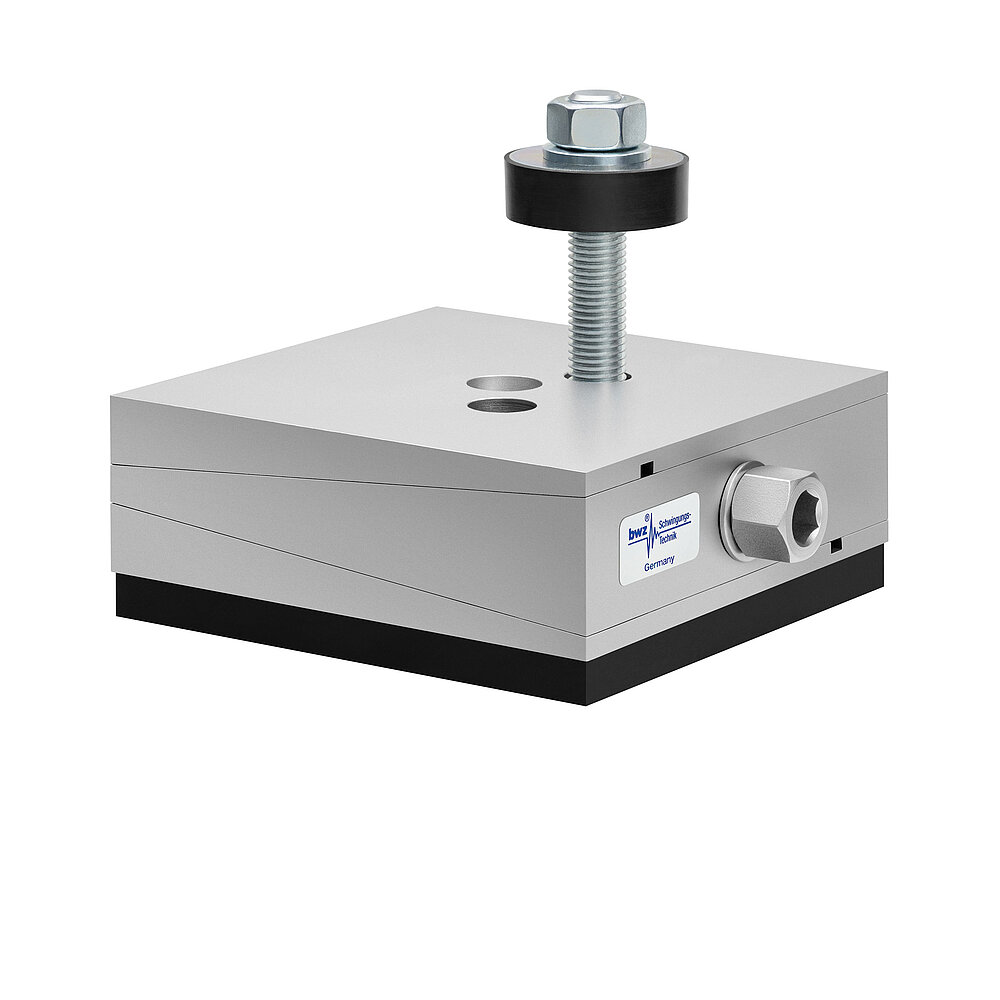 a square, height-adjustable machine mount made of precision-milled metal, adjusted in middle position, consisting of top, middle and bottom part lacquered in silver colour, with the wedge-shaped middle part featuring a protruding centered hexagonal screw for height adjustment, two holes for fastening screws in the top part, a fastening screw passing through the bottom part and sticking out on top with a screwhead isolation disc at the top screw end and a medium-thick black elastomer with smooth surface for passive vibration isolation at the bottom, isolated on white background